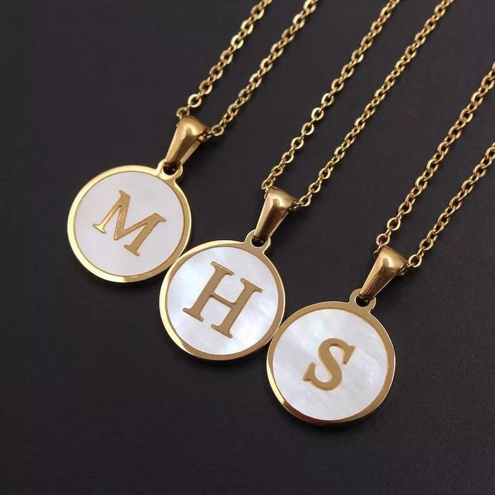 Gold Shell Initial Necklace.