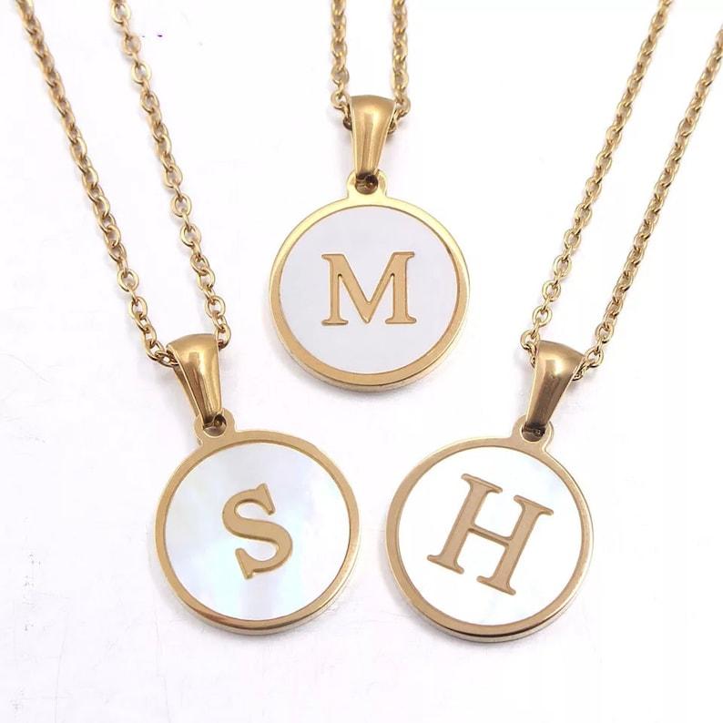 Gold Shell Initial Necklace.