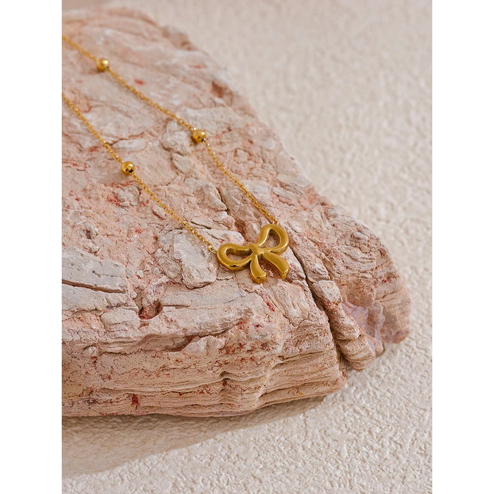 Riley Necklace (Golden Knot Pendant )