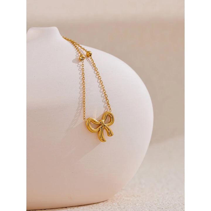 Riley Necklace (Golden Knot Pendant )