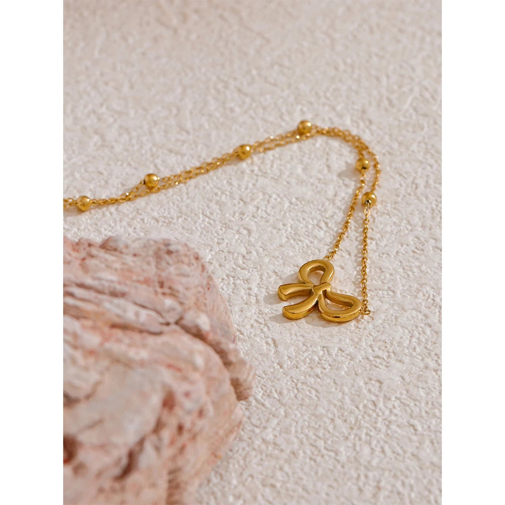 Riley Necklace (Golden Knot Pendant )