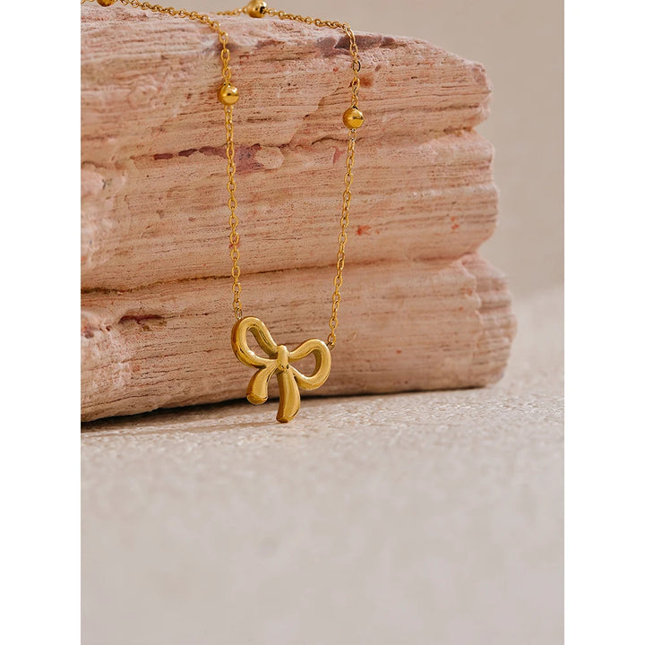 Riley Necklace (Golden Knot Pendant )