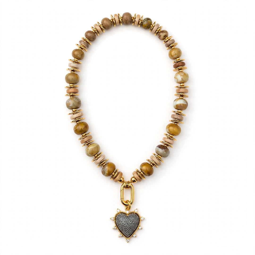 The Gilded Soul Necklace - full beaded necklace with gold carabiner and pave crystal heart pendant on a white background