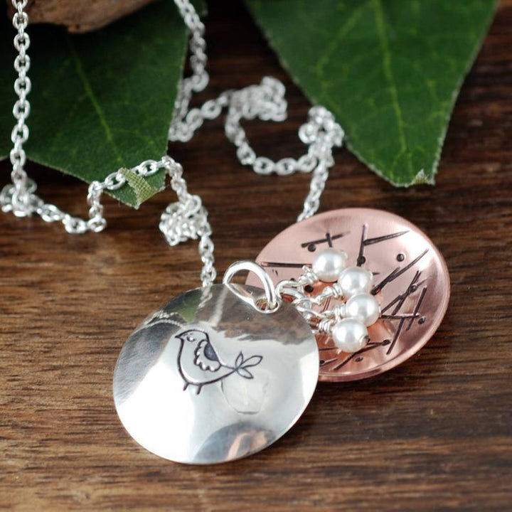 Mama Bird Necklace with Nesting Eggs.