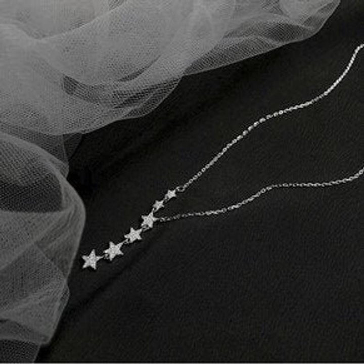 Sterling Silver Cascading Star Charm Necklace.