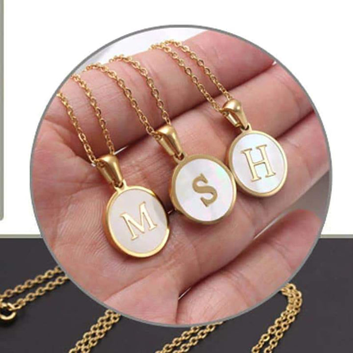 Gold Shell Initial Necklace.